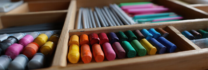 Art supplies colorful crayons pencils wooden drawer organized creative