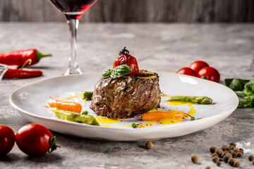 Gourmet beef steak with vegetables and sauce plating