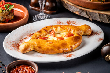 Golden khachapuri with melted cheese filling