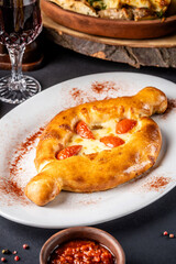 Fresh baked khachapuri with melted cheese