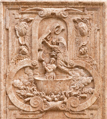 SALZBURG, AUSTIRA - SEPTEMBER 8 2025: The stone relief of martyrdom of St. Apollonia on exterior wall of the chapel Margarethenkapelle in the St. Peter Abtei cemetery by unknown artist.