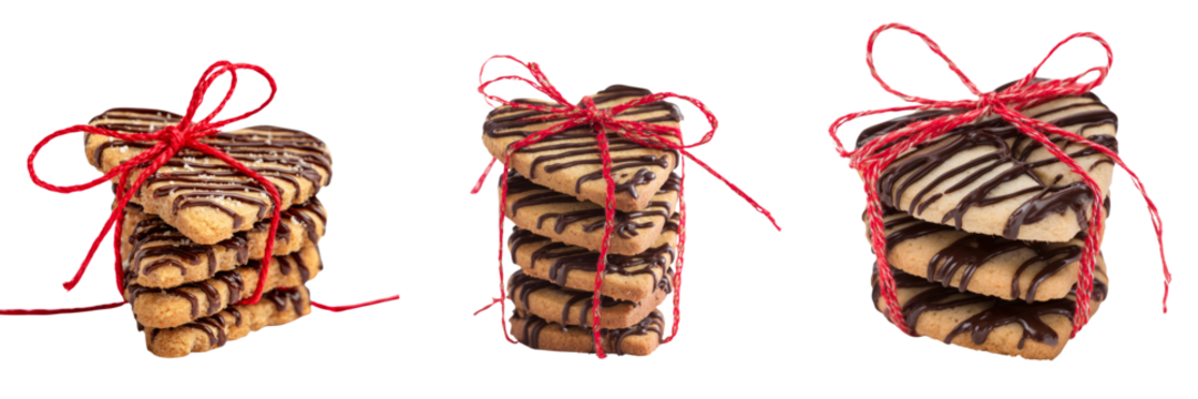 Delicious heart-shaped cookies with red ribbon on transparent background sweet treats studio