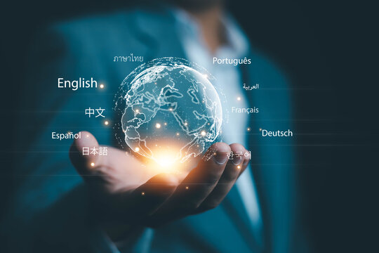A business professional holding a glowing digital globe surrounded by multiple language labels, representing multilingual communication, global connection, translation technology, worldwide access,
