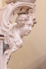 Naklejka premium SALERNO, ITALY - OCTOBER 6, 2025: The detail of angels from baroque main altar of church Chiesa della Santissima Annunziata by Matteo Bottiglieri from 16. cent.