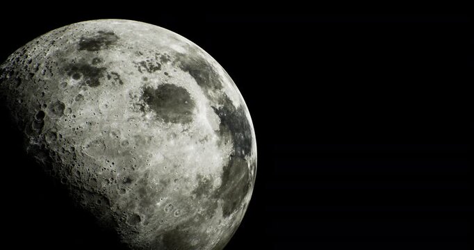 A striking view of the moon captures its detailed surface, showcasing various craters and textures. The moon stands out against a deep black sky, illuminating the night landscape beautifully.