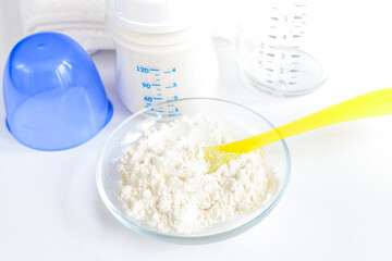 preparation of mixture baby feeding on white background