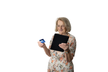 Senior woman smiling, online shopping with credit card and tablet