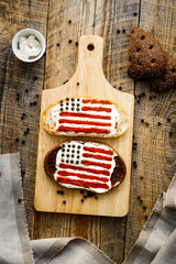 Two homemade sandwiches with image of american flag.