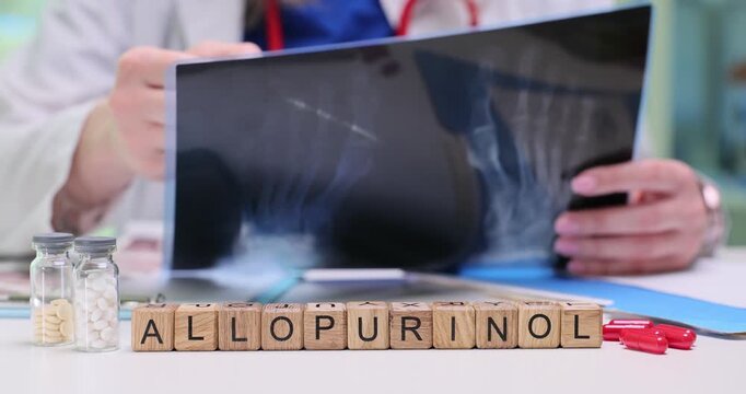 Wooden blocks spell word Allopurinol near spine x-ray sheet. Rheumatology doctor compares images reviewing allopurinol therapy notes at appointment