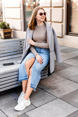 Portrait of a Happy Woman in Sunglasses Outdoors