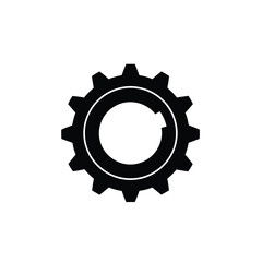 Black silhouette of a gear with inner circle on white background