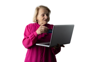 Senior woman shopping online using laptop and credit card
