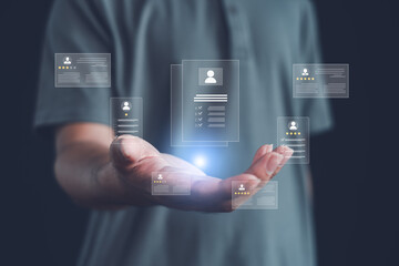 Digital recruitment concept showing a person presenting holographic resumes and candidate profiles, representing modern HR technology, talent evaluation, and online hiring processes.