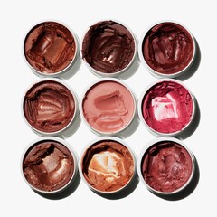 Luxurious collection of colorful lip and cheek tints in sleek containers for a modern makeup campaign showcasing vibrant beauty products