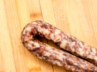 Sausage on a wooden board.