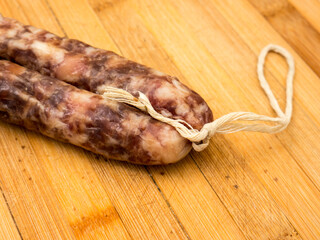 Sausage on a wooden board.