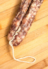 Sausage on a wooden board.
