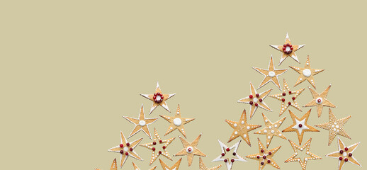 Christmas tree made of ginger star shape sugar cookies. Conceptual Christmas sweet food ornament....