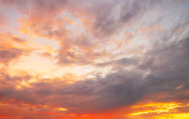 Obraz premium Background: Orange and red sky and clouds during Twilight,Orange-red sky during the twilight period.