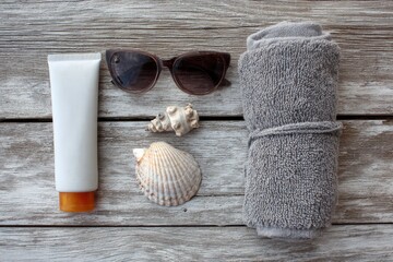 Sun-kissed beach essentials on weathered wood