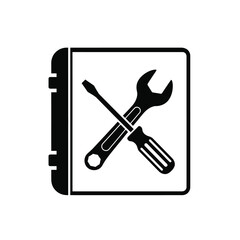 Black silhouette of wrench and screwdriver on open book