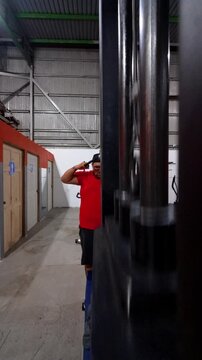 Video of a plus size man working out on a pulley machine at the gym. 