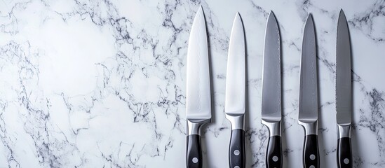 Chef's Knives Arrayed on Marble: Culinary Tools, Sharp Blades, Kitchenware.