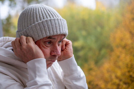 mature bald man man lost in deep thoughts outdoors, mental health senior sad expression while gazing away, melancholy and reflection, retirement lifestyle, simple portrait, rest and contentment - Powered by Adobe