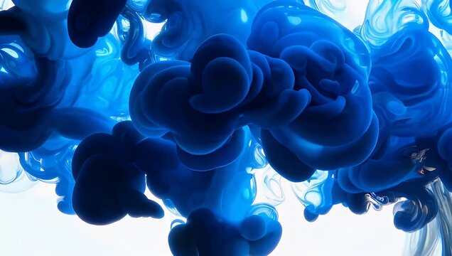 Graceful azure ink plumes dissolving in pristine water, forming intricate patterns and a captivating fluid dynamics spectacle