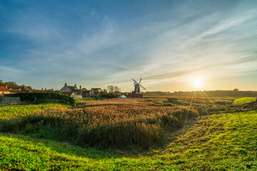 Cley Windmill at sunset in the village of Cley, Norfolk, UK