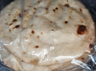 Stack of Fresh bread in Plastic Packaging