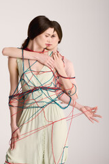 Beautiful twin sisters express creativity through a colorful yarn art installation