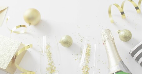 Displaying festive drink setup featuring two champagne flutes and sparkling bottle on white surface © vectorfusionart