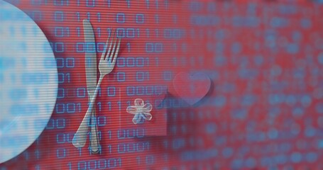 Showing table arrangement on red table with round plate, gift box, heart token and binary overlay