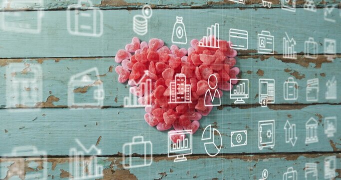 Naklejki Showing heart-shaped candy cluster sitting on worn turquoise planks, with business icons overlay