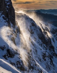 Dramatic Mountain Landscape with Snow and Wind in Golden Hour Light