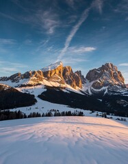 Serene Winter Landscape with Majestic Mountains and Blue Sky