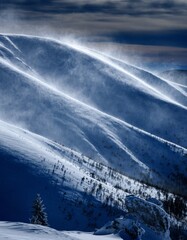 Snowy Mountain Landscape with Whirling Wind and Scenic Outlook