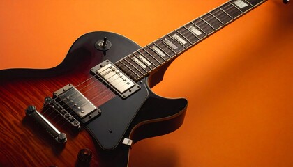 Electric Guitar with Glossy Wood Finish and Dual Humbuckers Against Warm Orange Background in Musical Close-Up