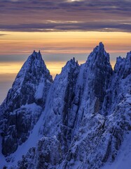 Majestic Snow-Capped Peaks Under Stunning Golden Hour Sky