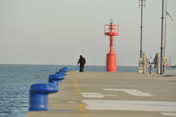 man walking on the pier
