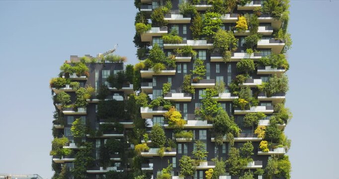 Detail of Bosco Verticale towers facade, covered by shrubs and trees, Milan, Italy
