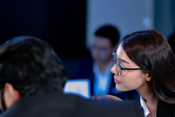 Overtime grind. Focused team tackles complex project late night in modern tech hub view over shoulder showing code intense digital workplace productive collaboration.