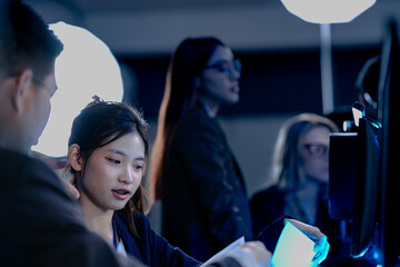 Cyber defenders hold the line late night ops center. Focused diverse analysts track threats multiple screens real time data intelligence crucial vigilance protects vital systems now.