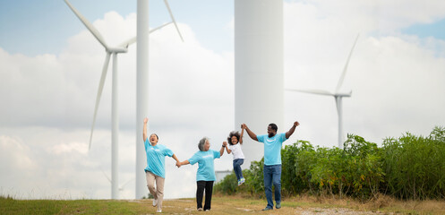Volunteers are walking behind a windmill farm, volunteer charity people. charity community service event, ngo business and outreach, Group Diverse people meeting at park for donation