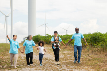 Volunteers are walking behind a windmill farm, volunteer charity people. charity community service event, ngo business and outreach, Group Diverse people meeting at park for donation