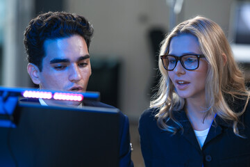 Onboarding future skills now. Experienced lead guides new talent navigating complex AI interface screen shows advanced data streams accelerated learning immersive tech hub build mode activated go.