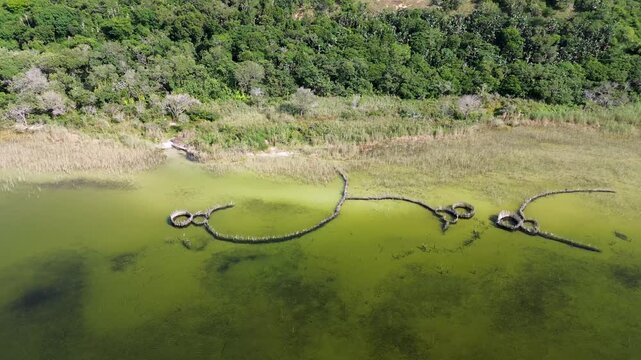 Thonga or Tsonga Fish traps on the edge of Kosi Lake at Kosi Bay, camera moving left to right along the lake shore, showing the fish traps. 4K Aerial Video.