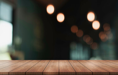 Empty wooden table top with lights bokeh on blur restaurant background.	