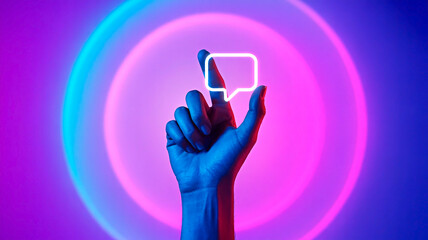 Chat bubble illuminated with neon lights for the concept of communication and digital interaction.